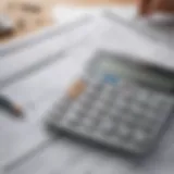 Calculator and financial papers showcasing budgeting for home buying